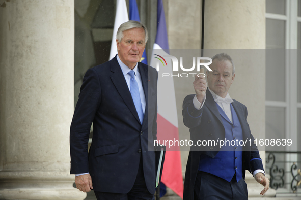 Newly appointed French Prime Minister Michel Barnier leaves the Elysee Palace after the meeting of the council of ministers with the French...