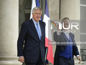 Newly appointed French Prime Minister Michel Barnier leaves the Elysee Palace after the meeting of the council of ministers with the French...