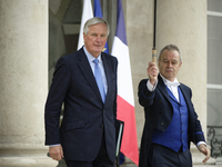 Newly appointed French Prime Minister Michel Barnier leaves the Elysee Palace after the meeting of the council of ministers with the French...