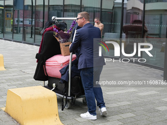 A guest leaves the hotel at Labour Conference in Liverpool, United Kingdom, on September 25, 2024. (