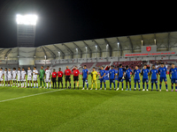 Players from Qatar and Singapore line up before the 2025 AFC U20 Asian Cup Qualifiers Group J match between Qatar and Singapore at Abdullah...