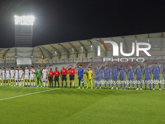 Players from Qatar and Singapore line up before the 2025 AFC U20 Asian Cup Qualifiers Group J match between Qatar and Singapore at Abdullah...