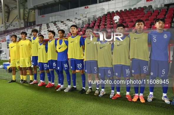 Substitute players of Singapore line up before the 2025 AFC U20 Asian Cup Qualifiers Group J match between Qatar and Singapore at Abdullah b...