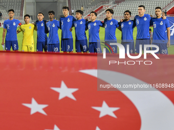 Players from Singapore line up before the 2025 AFC U20 Asian Cup Qualifiers Group J match between Qatar and Singapore at Abdullah bin Khalif...