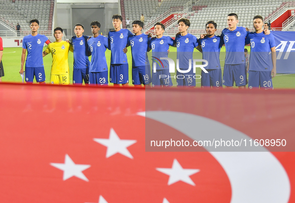 Players from Singapore line up before the 2025 AFC U20 Asian Cup Qualifiers Group J match between Qatar and Singapore at Abdullah bin Khalif...