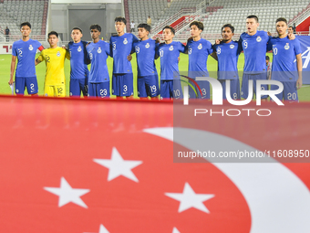 Players from Singapore line up before the 2025 AFC U20 Asian Cup Qualifiers Group J match between Qatar and Singapore at Abdullah bin Khalif...