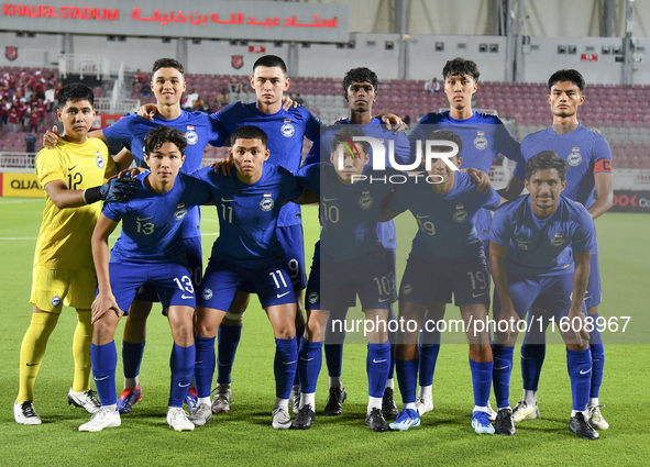 Singapore players pose for a team photo prior to the 2025 AFC U20 Asian Cup Qualifiers Group J match between Qatar and Singapore at Abdullah...