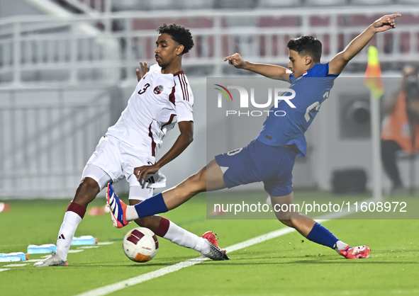 Motaman Mohamed (L) of Qatar battles for the ball with Iryan Fandi (R) of Singapore during the 2025 AFC U20 Asian Cup Qualifiers Group J mat...