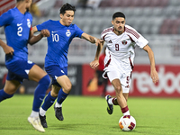 Ibrahim Mohammadali (R) of Qatar battles for the ball with Jonan Tan (L) of Singapore during the 2025 AFC U20 Asian Cup Qualifiers Group J m...