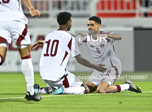 Ibrahim Mohammadali of Qatar celebrates after scoring the opening goal during the 2025 AFC U20 Asian Cup Qualifiers Group J match between Qa...