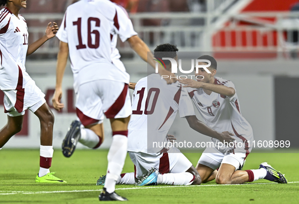 Ibrahim Mohammadali of Qatar celebrates after scoring the opening goal during the 2025 AFC U20 Asian Cup Qualifiers Group J match between Qa...