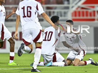 Ibrahim Mohammadali of Qatar celebrates after scoring the opening goal during the 2025 AFC U20 Asian Cup Qualifiers Group J match between Qa...