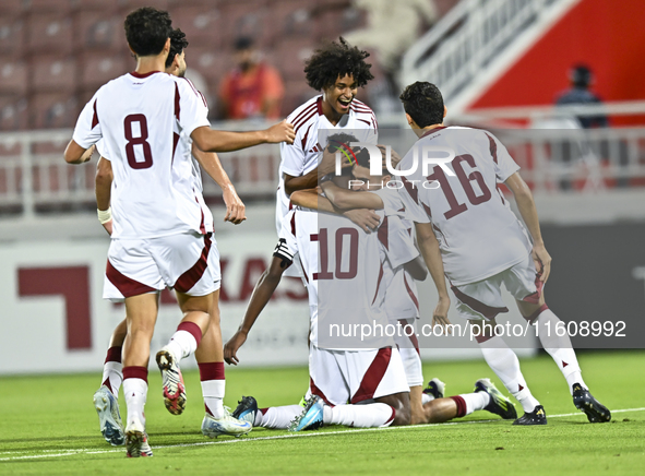 Ibrahim Mohammadali (#10) of Qatar celebrates after scoring the opening goal during the 2025 AFC U20 Asian Cup Qualifiers Group J match betw...