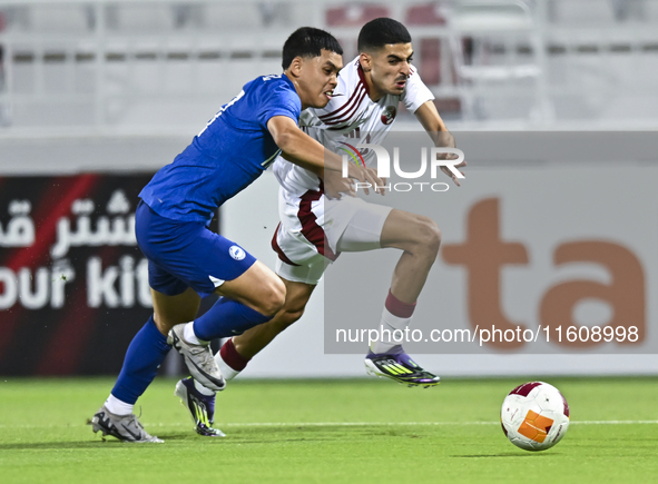 Mohamed Khaled Gouda (R) of Qatar battles for the ball with Fairuz Fazli (L) of Singapore during the 2025 AFC U20 Asian Cup Qualifiers Group...