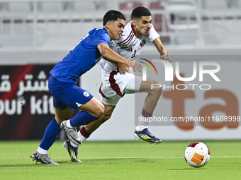 Mohamed Khaled Gouda (R) of Qatar battles for the ball with Fairuz Fazli (L) of Singapore during the 2025 AFC U20 Asian Cup Qualifiers Group...