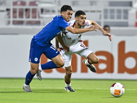 Mohamed Khaled Gouda (R) of Qatar battles for the ball with Fairuz Fazli (L) of Singapore during the 2025 AFC U20 Asian Cup Qualifiers Group...