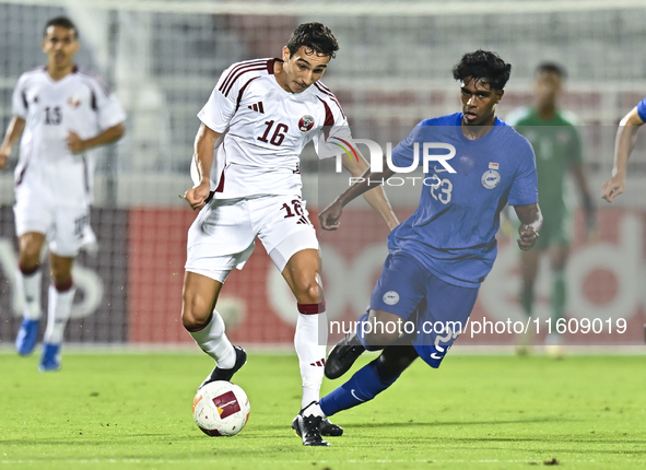 Mohamed Hani Faragalla of Qatar battles for the ball with Marcus Mosses of Singapore during the 2025 AFC U20 Asian Cup Qualifiers Group J ma...