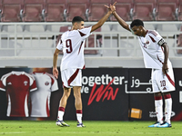 Mohamed Khaled Gouda (L) of Qatar celebrates after scoring the goal during the 2025 AFC U20 Asian Cup Qualifiers Group J match between Qatar...