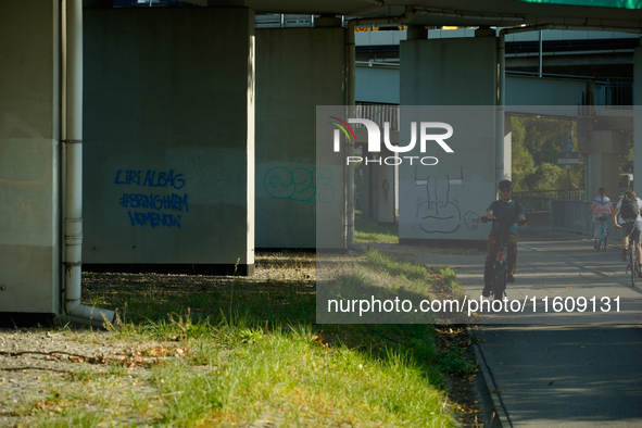 Graffiti calling for the return of Israeli hostages held by Hamas militants is seen painted on structures in Warsaw, Poland on 25 September,...