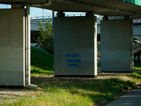 Graffiti calling for the return of Israeli hostages held by Hamas militants is seen painted on structures in Warsaw, Poland on 25 September,...