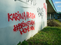 Graffiti calling for the return of Israeli hostages held by Hamas militants is seen painted on structures in Warsaw, Poland on 25 September,...