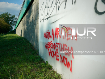 Graffiti calling for the return of Israeli hostages held by Hamas militants is seen painted on structures in Warsaw, Poland on 25 September,...