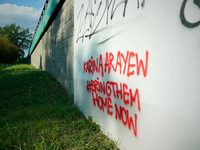 Graffiti calling for the return of Israeli hostages held by Hamas militants is seen painted on structures in Warsaw, Poland on 25 September,...