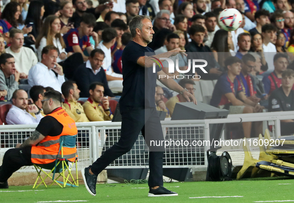 Hansi Flick coaches during the match between FC Barcelona and Getafe CF, corresponding to week 7 of LaLiga EA Sports, at the Lluis Companys...