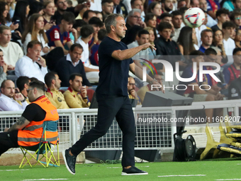 Hansi Flick coaches during the match between FC Barcelona and Getafe CF, corresponding to week 7 of LaLiga EA Sports, at the Lluis Companys...