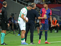 Hansi Flick and Lamine Yamal during the match between FC Barcelona and Getafe CF, corresponding to week 7 of LaLiga EA Sports, at the Lluis...