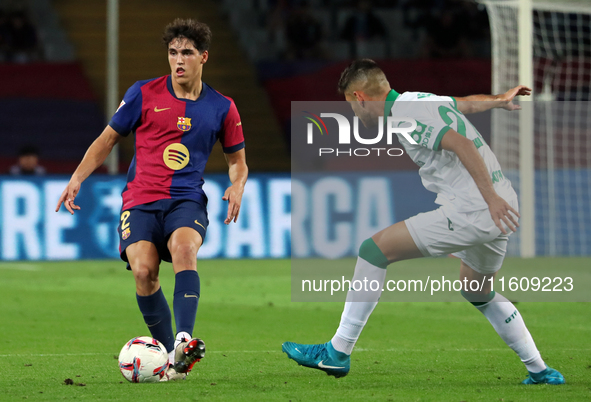 Pau Cubarsi and Juan Iglesias play during the match between FC Barcelona and Getafe CF, corresponding to week 7 of LaLiga EA Sports, at the...