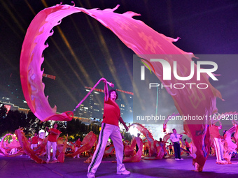 A mass performance celebrates the 75th anniversary of the founding of New China in Handan, China, on September 25, 2024. (