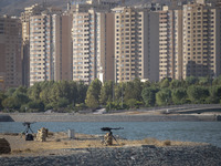 Two machine guns are placed in an area near housing complexes during the reconstruction of the Valfajr-8 military operation, commemorating t...