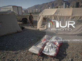 Two symbolic figures of Iranian warriors covered with Iranian flags are depicted during the reconstruction of the Valfajr-8 military operati...