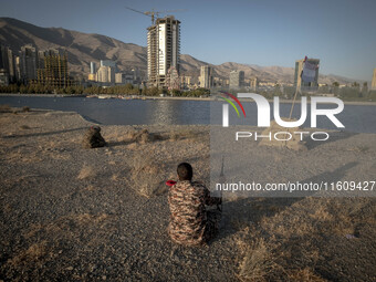 A member of the Islamic Revolutionary Guard Corps (IRGC) takes part in a war game, which is a reconstruction of the Valfajr-8 military opera...