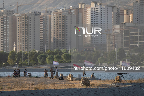 Members of the Islamic Revolutionary Guard Corps (IRGC) take part in a war game, which is a reconstruction of the Valfajr-8 military operati...