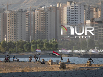 Members of the Islamic Revolutionary Guard Corps (IRGC) take part in a war game, which is a reconstruction of the Valfajr-8 military operati...