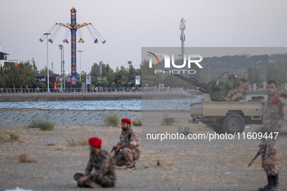 Members of the Islamic Revolutionary Guard Corps (IRGC) take part in a war game, which is a reconstruction of the Valfajr-8 military operati...