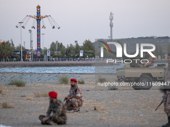 Members of the Islamic Revolutionary Guard Corps (IRGC) take part in a war game, which is a reconstruction of the Valfajr-8 military operati...