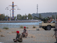 Members of the Islamic Revolutionary Guard Corps (IRGC) take part in a war game, which is a reconstruction of the Valfajr-8 military operati...