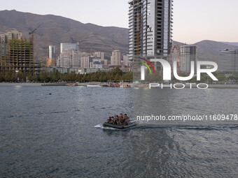 Islamic Revolutionary Guard Corps (IRGC) military personnel sail a speedboat in a lake during a war game that reconstructs the Valfajr-8 mil...