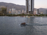 Islamic Revolutionary Guard Corps (IRGC) military personnel sail a speedboat in a lake during a war game that reconstructs the Valfajr-8 mil...