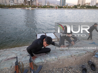 Islamic Revolutionary Guard Corps (IRGC) military personnel take part in a war game, which is a reconstruction of the Valfajr-8 military ope...