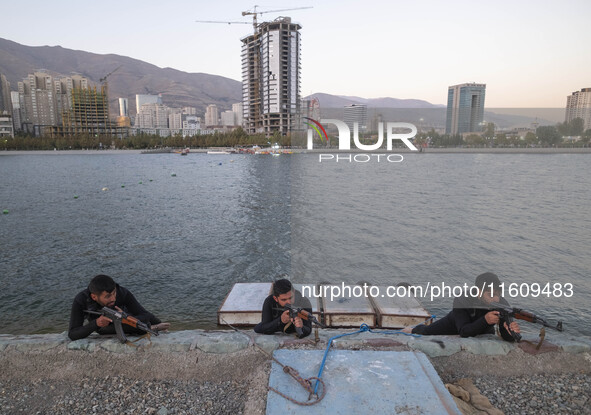 Islamic Revolutionary Guard Corps (IRGC) military personnel take part in a war game, which is a reconstruction of the Valfajr-8 military ope...