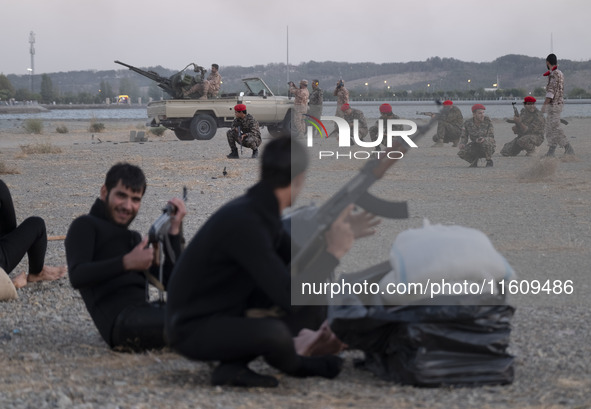 Islamic Revolutionary Guard Corps (IRGC) military personnel take part in a war game, which is a reconstruction of the Valfajr-8 military ope...