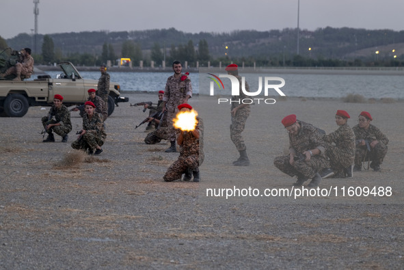 Islamic Revolutionary Guard Corps (IRGC) military personnel take part in a war game, which is a reconstruction of the Valfajr-8 military ope...