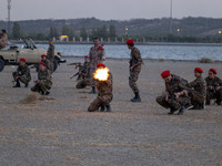 Islamic Revolutionary Guard Corps (IRGC) military personnel take part in a war game, which is a reconstruction of the Valfajr-8 military ope...