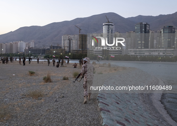 An Islamic Revolutionary Guard Corps (IRGC) military personnel takes part in a war game, which is a reconstruction of the Valfajr-8 military...