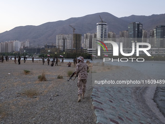 An Islamic Revolutionary Guard Corps (IRGC) military personnel takes part in a war game, which is a reconstruction of the Valfajr-8 military...