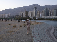 An Islamic Revolutionary Guard Corps (IRGC) military personnel takes part in a war game, which is a reconstruction of the Valfajr-8 military...